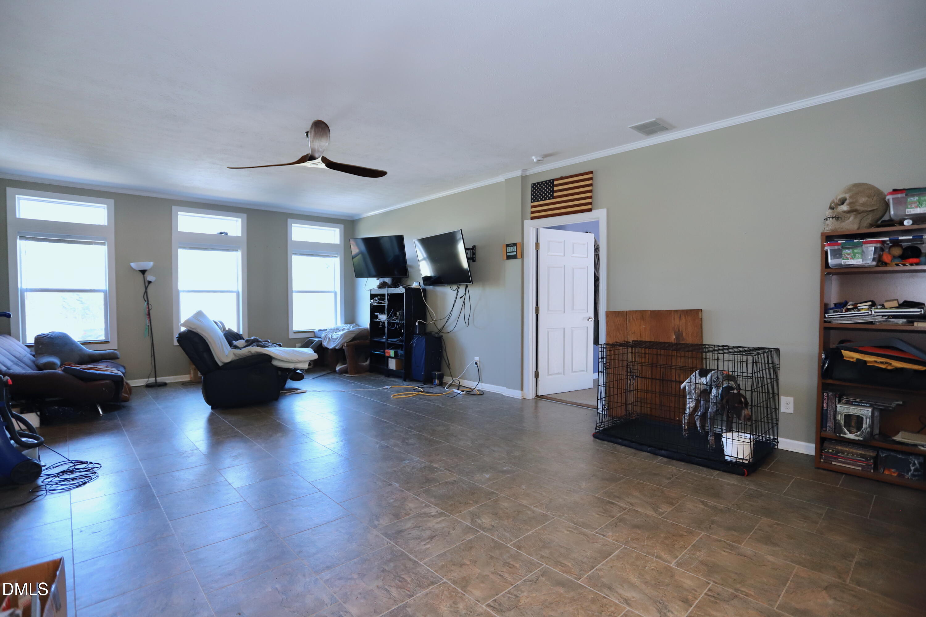 6764 Bradshaw Farm Road Efland, NC 27243 - Photo 11 of 56 a living room with furniture and a book shelf