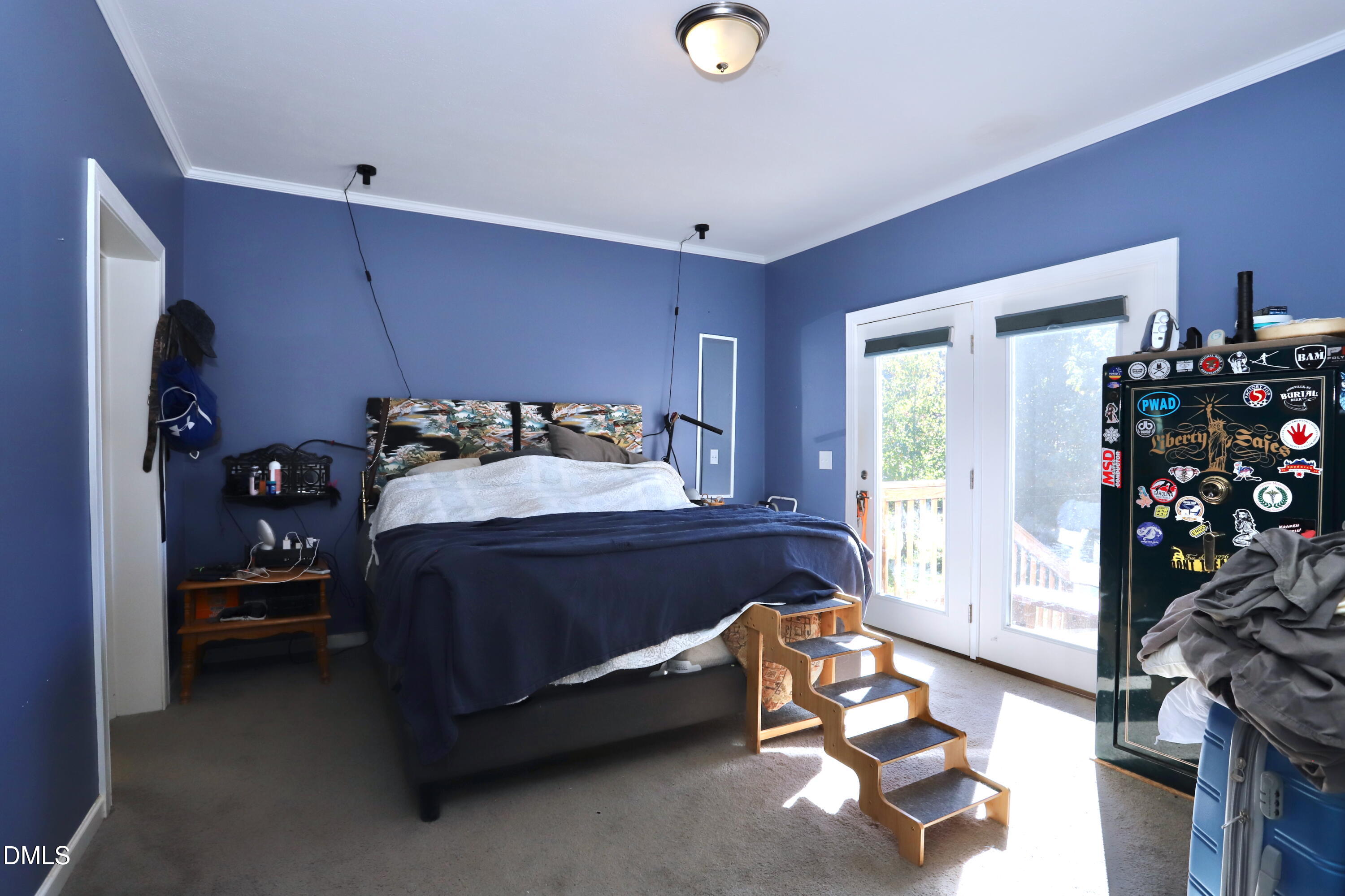 6764 Bradshaw Farm Road Efland, NC 27243 - Photo 13 of 56 a bedroom with a bed and a window