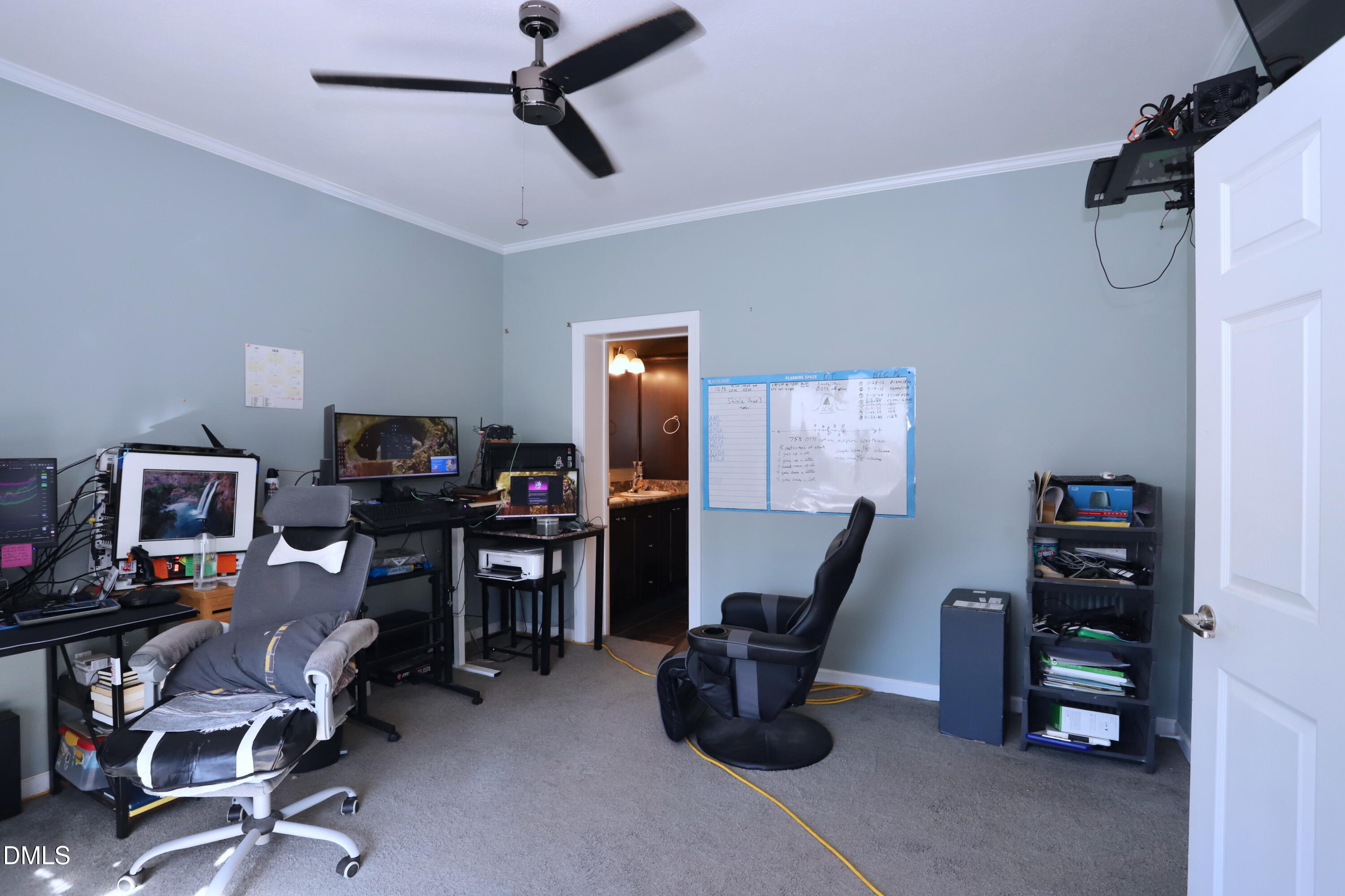 6764 Bradshaw Farm Road Efland, NC 27243 - Photo 22 of 56 a view of a workspace with furniture and a window