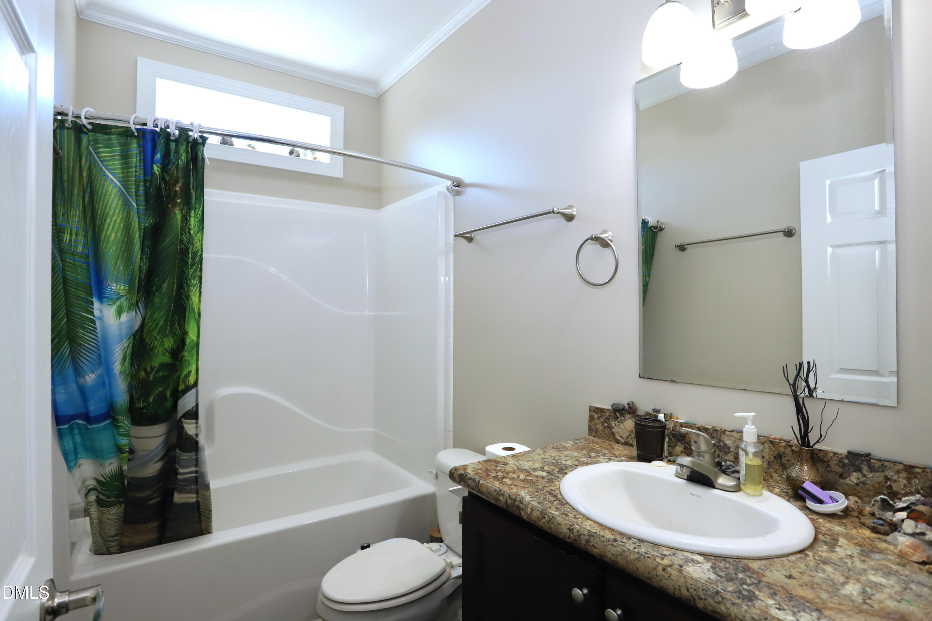 6764 Bradshaw Farm Road Efland, NC 27243 - Photo 29 of 56 a bathroom with a granite countertop sink toilet and shower