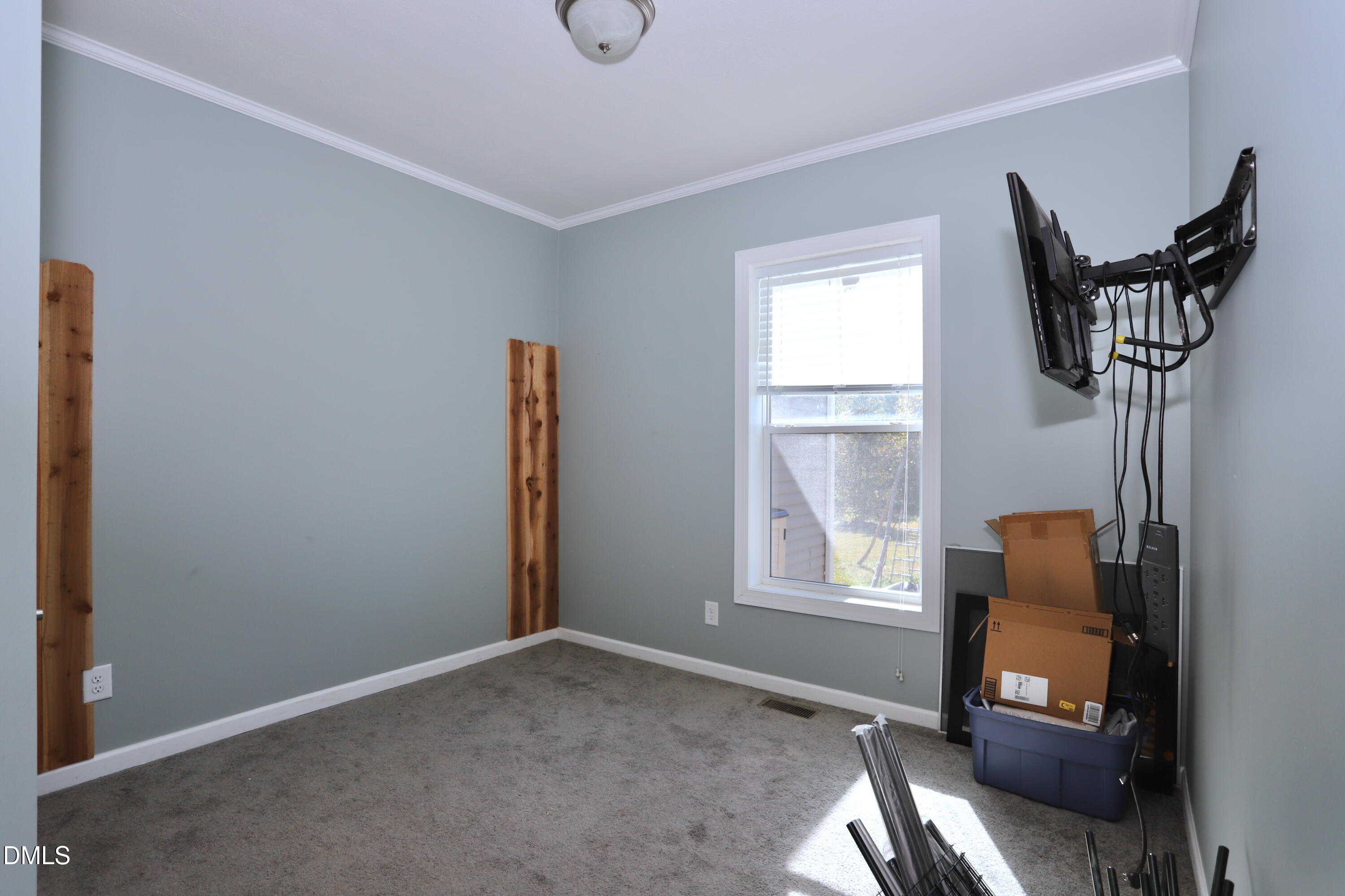 6764 Bradshaw Farm Road Efland, NC 27243 - Photo 30 of 56 a living room with furniture and a window