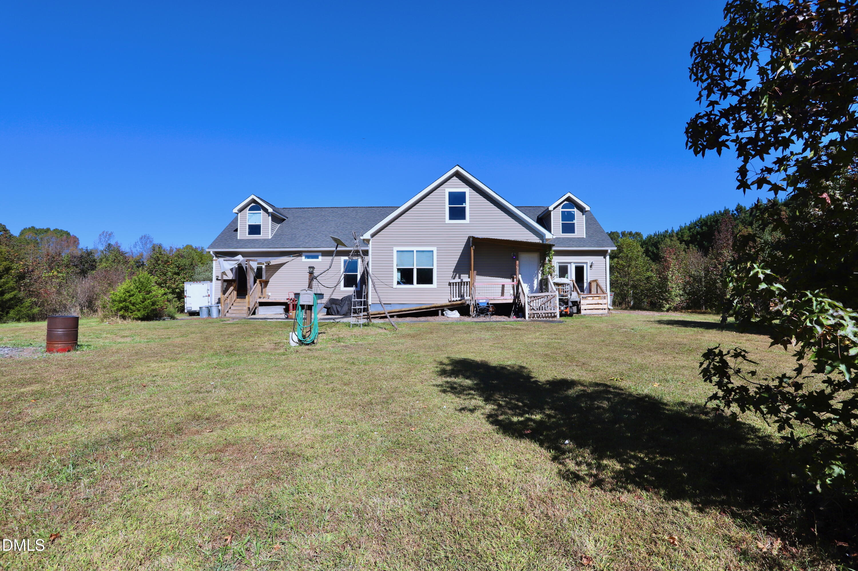 6764 Bradshaw Farm Road Efland, NC 27243 - Photo 4 of 56 a front view of a house with a big yard