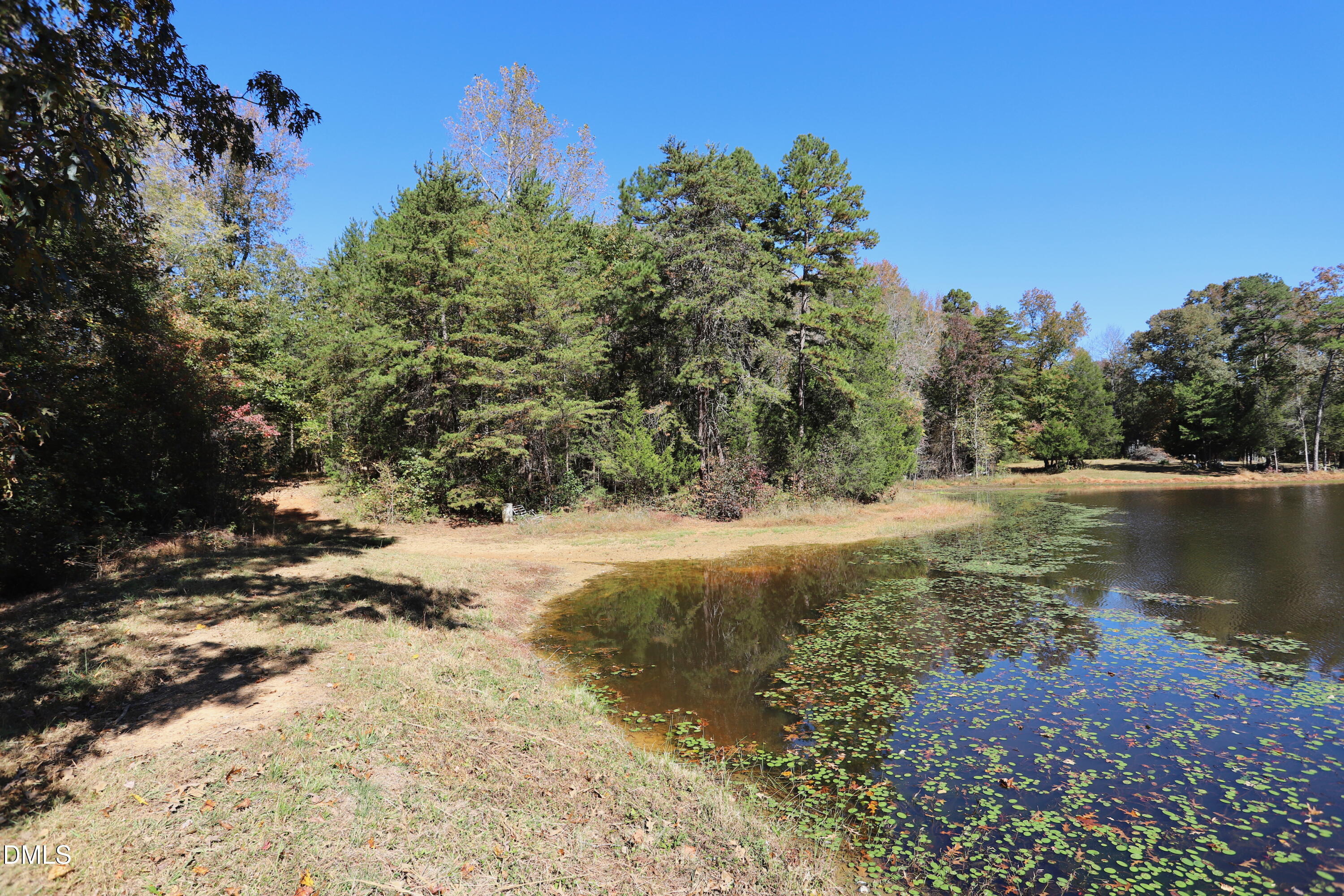 6764 Bradshaw Farm Road Efland, NC 27243 - Photo 55 of 56 a view of a lake with houses