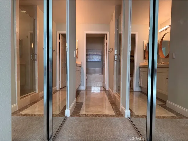 a view of a bathroom with tub and shower
