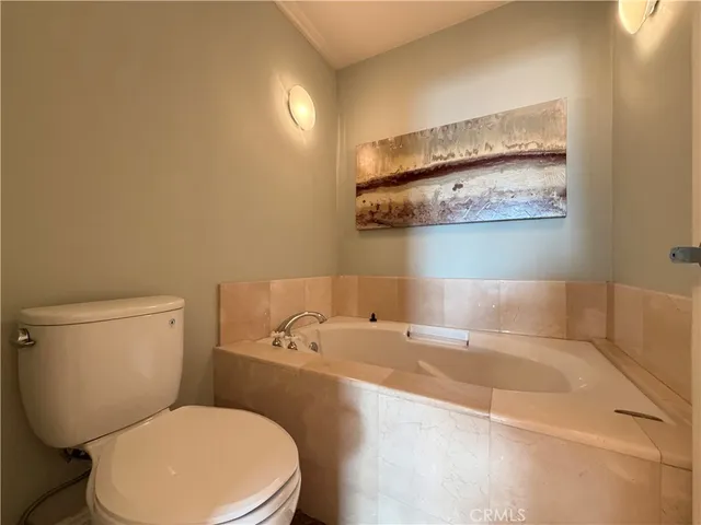 a bathroom with a toilet and sink