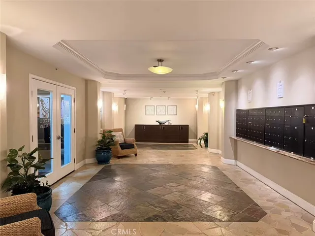 a view of a livingroom with furniture and a flat screen tv