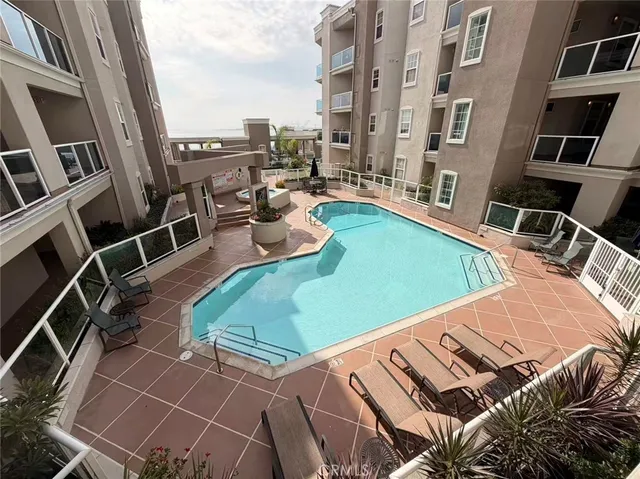 a view of a backyard with seating area