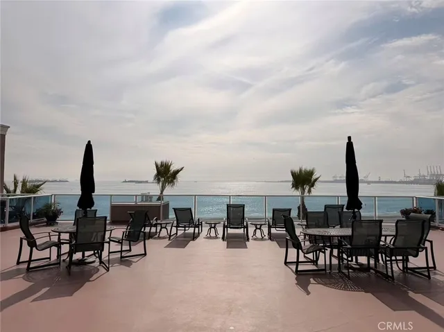 a view of a patio with table and chairs