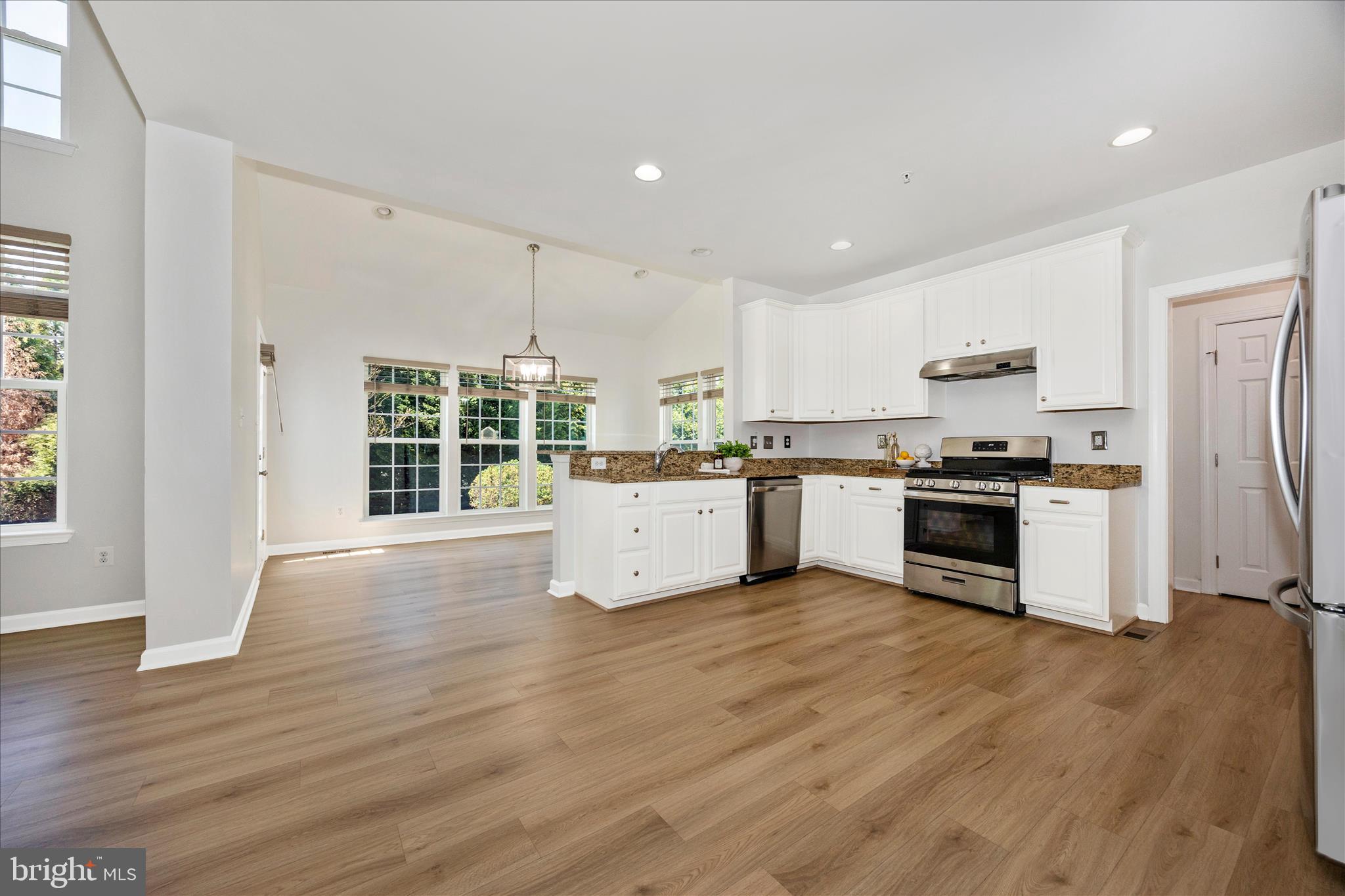 9145 Bealls Farm Road Frederick, MD 21704 - Photo 13 of 88 a kitchen with wooden floors and white stainless steel appliances