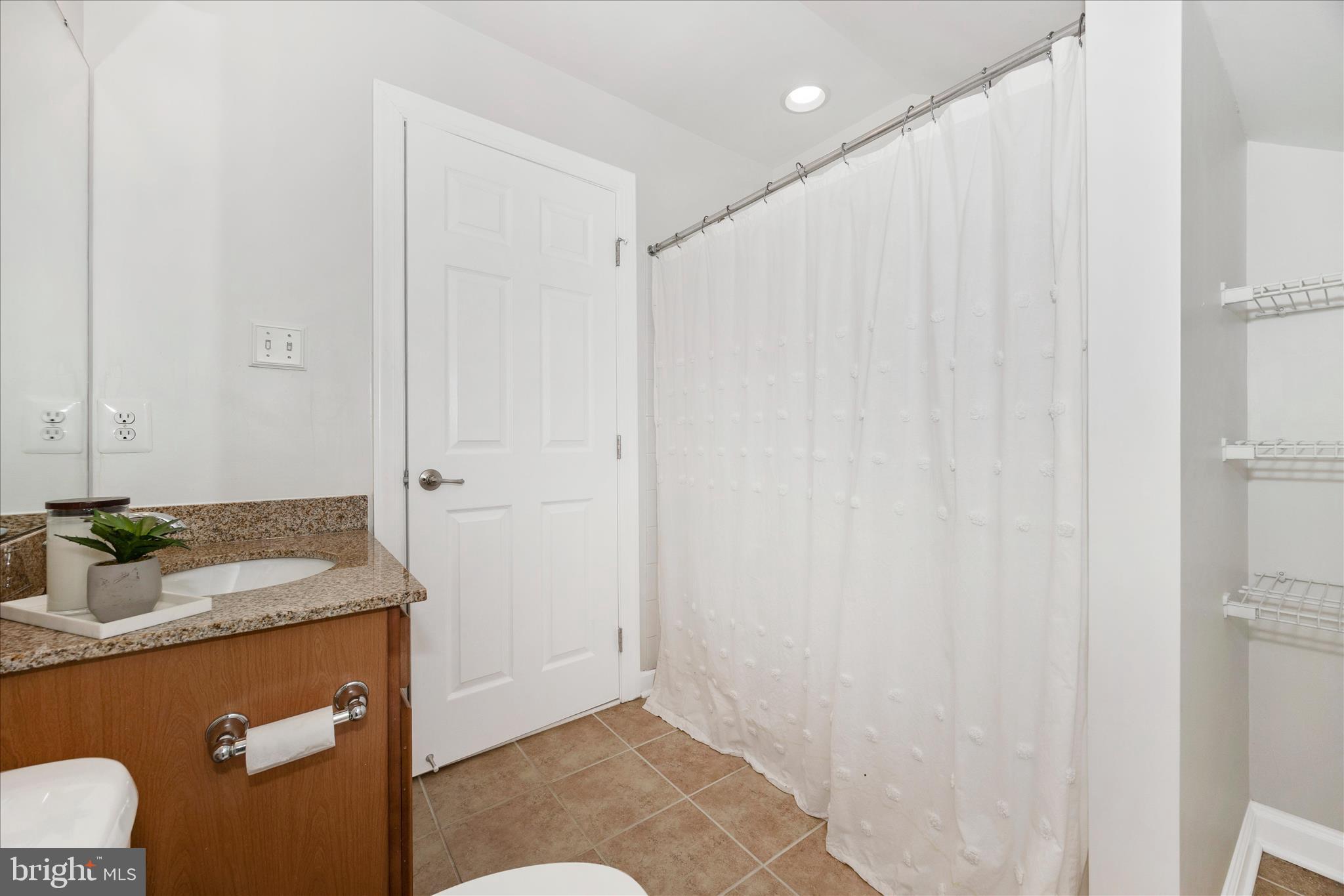 9145 Bealls Farm Road Frederick, MD 21704 - Photo 39 of 88 a bathroom with a granite countertop sink and a mirror