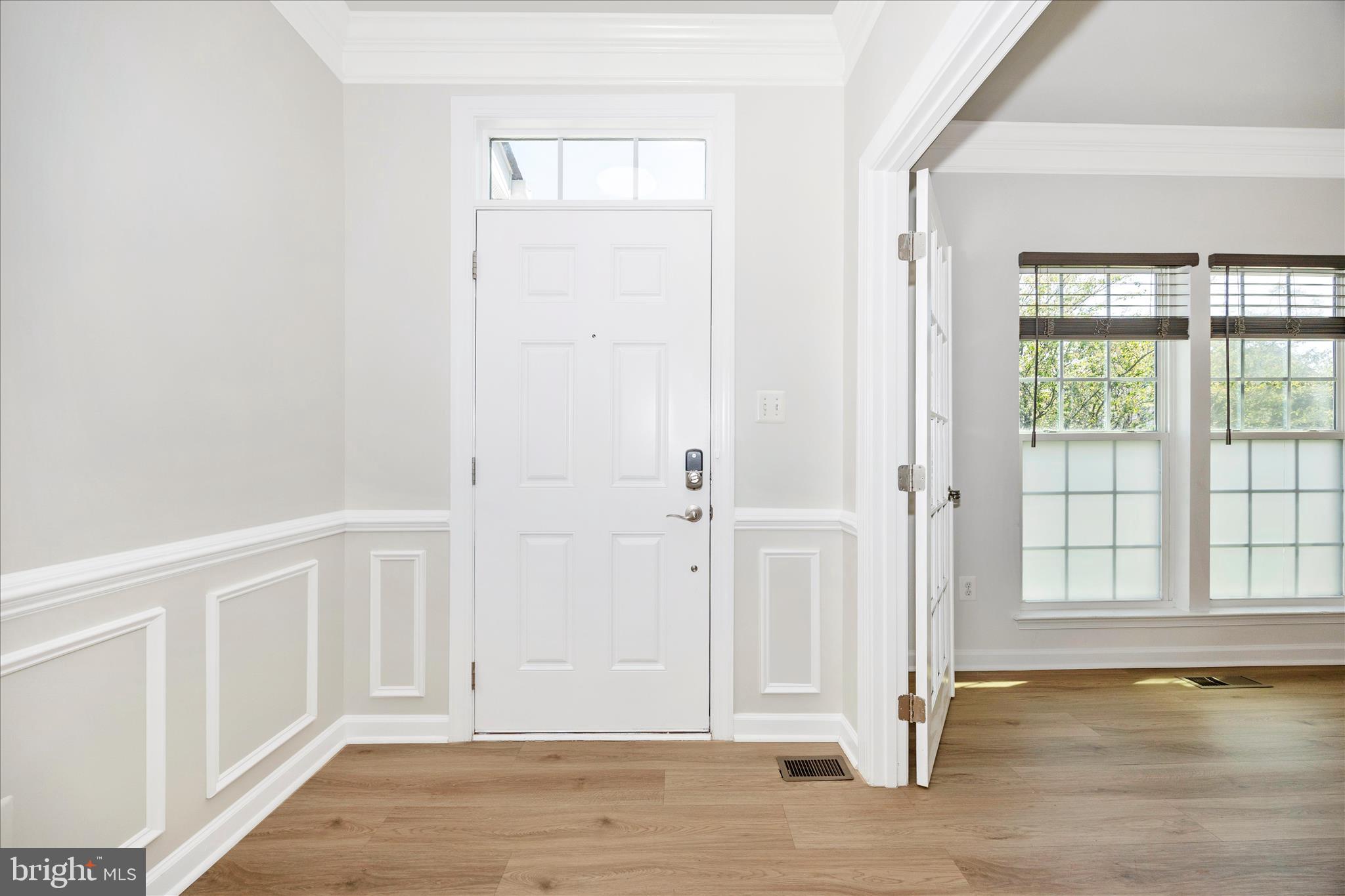 9145 Bealls Farm Road Frederick, MD 21704 - Photo 4 of 88 an empty room with wooden floor and windows