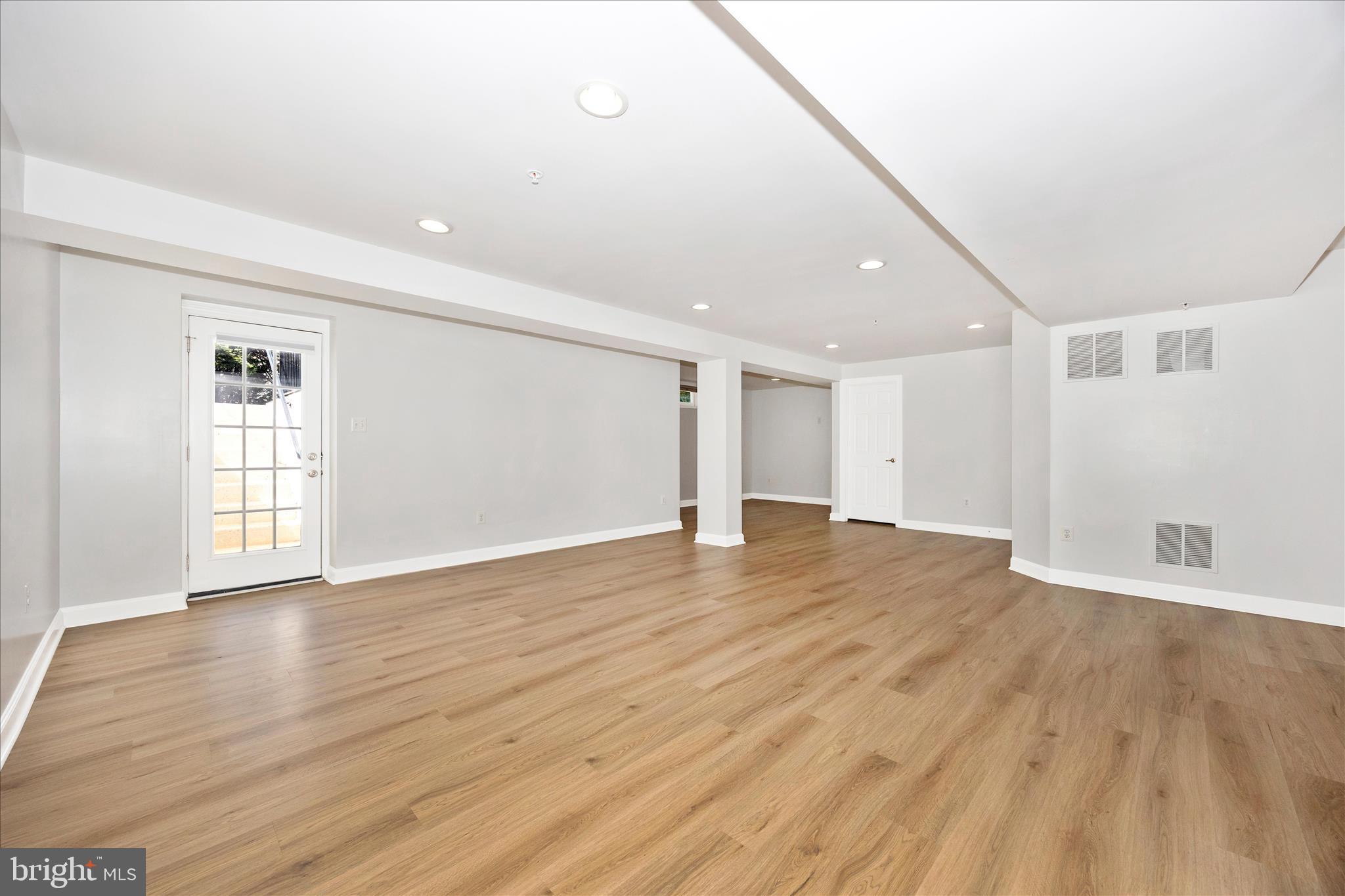 9145 Bealls Farm Road Frederick, MD 21704 - Photo 41 of 88 a view of an empty room with wooden floor and a window