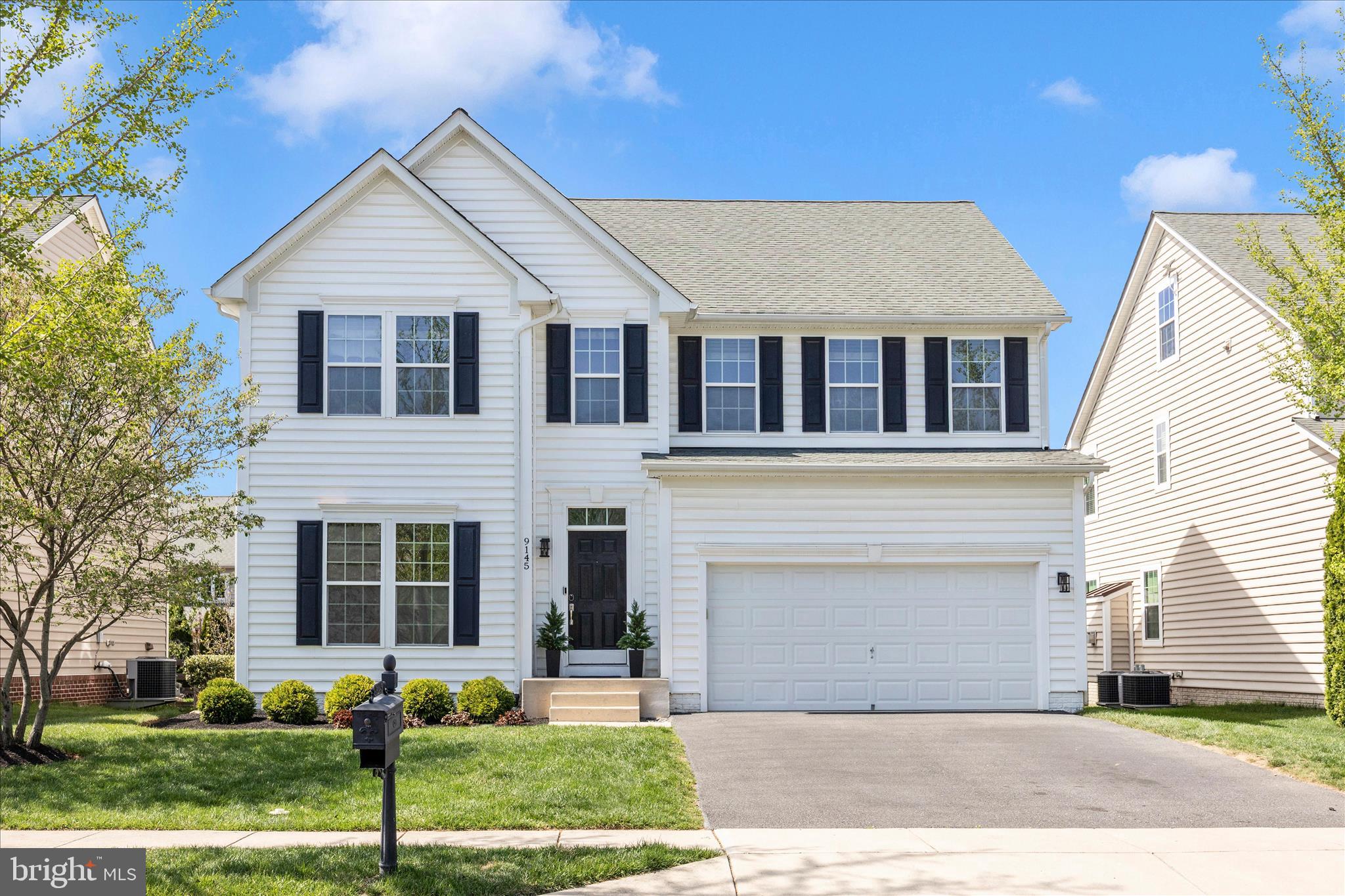 9145 Bealls Farm Road Frederick, MD 21704 - Photo 56 of 88 a front view of a house with a yard and garage