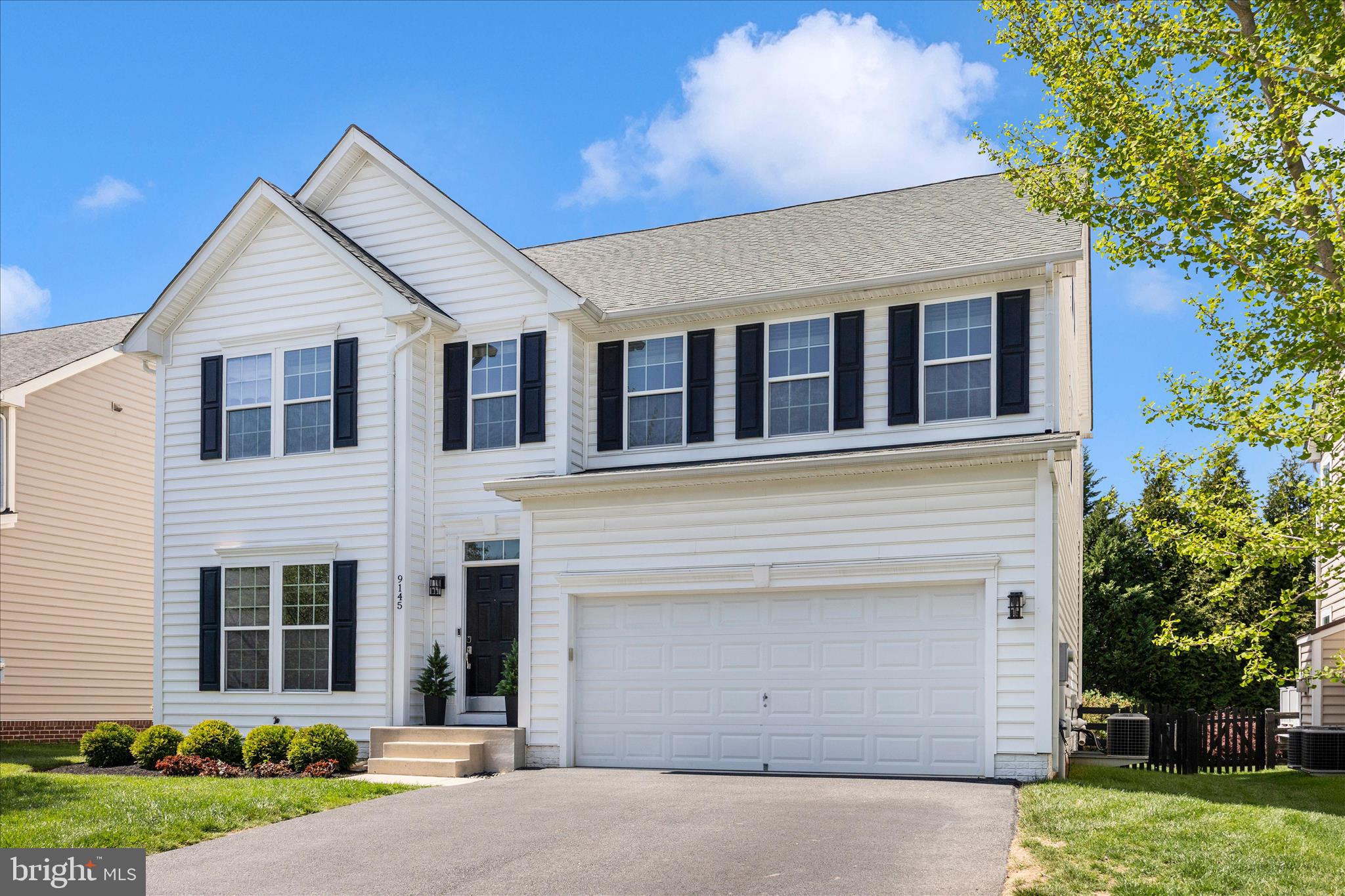 9145 Bealls Farm Road Frederick, MD 21704 - Photo 57 of 88 a view of a white house with a yard and large tree