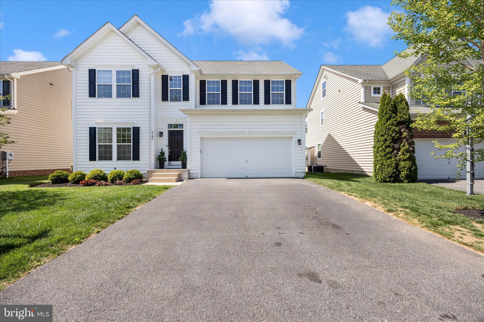 9145 Bealls Farm Road Frederick, MD 21704 - Photo 59 of 88 a front view of a house with a yard and garage
