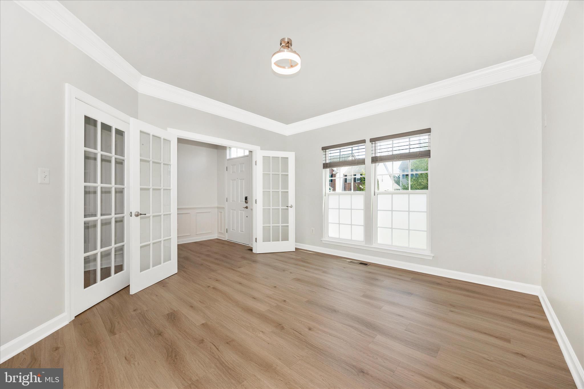 9145 Bealls Farm Road Frederick, MD 21704 - Photo 6 of 88 an empty room with wooden floor and windows