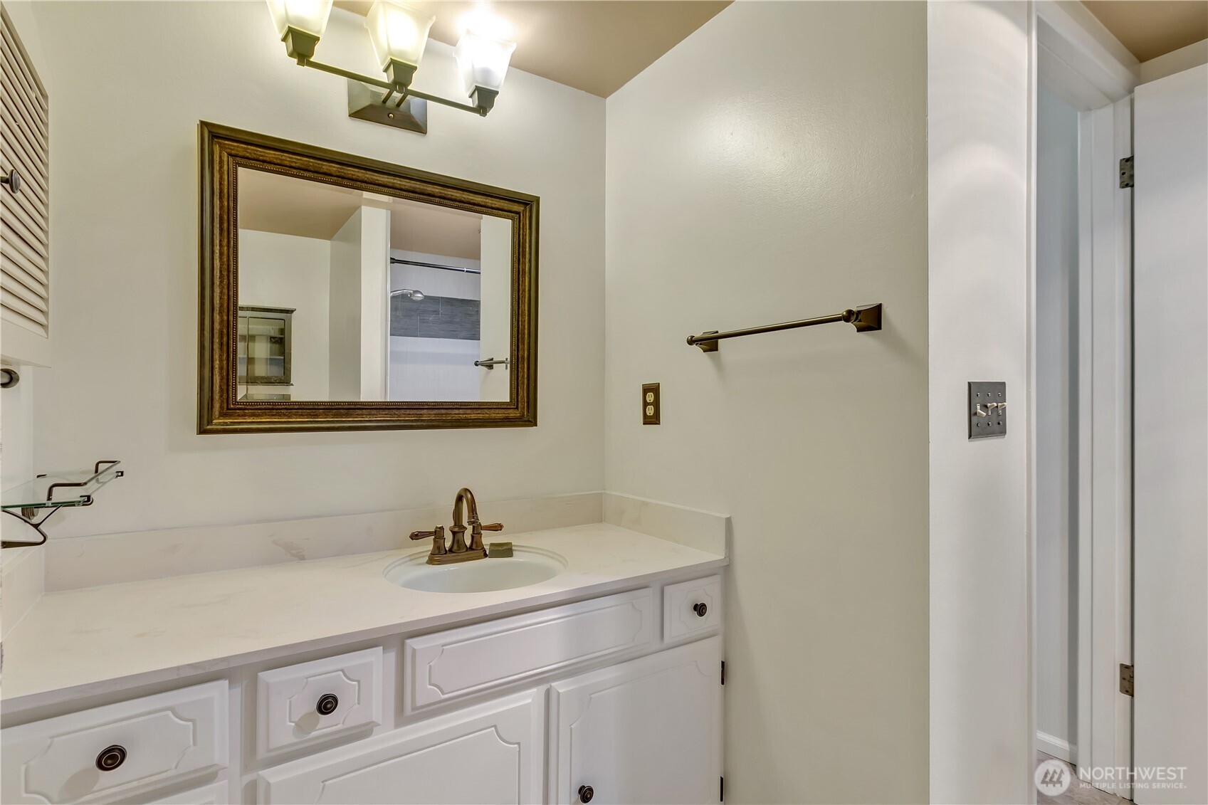 4545 Sand Point Way Northeast, Unit 207 Seattle, WA 98105 - Photo 21 of 25 a bathroom with a sink and a mirror