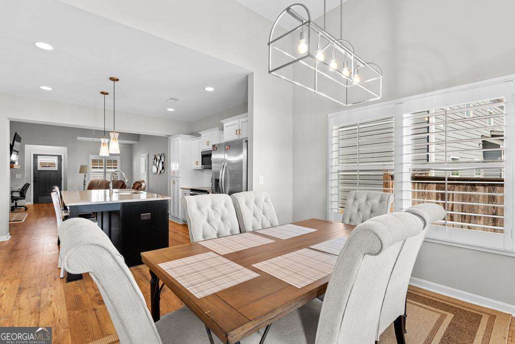 121 Cedar Pk Way Carrollton, GA 30117 - Photo 11 of 33 a view of a dining room with furniture and wooden floor