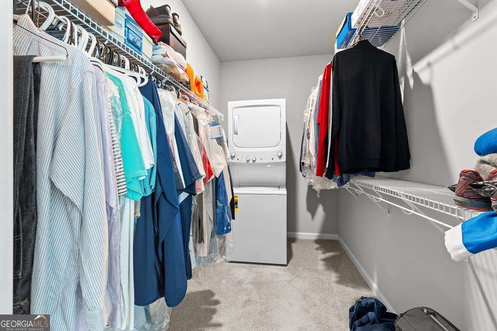 121 Cedar Pk Way Carrollton, GA 30117 - Photo 19 of 33 a view of walk in closet with clothes and shoes