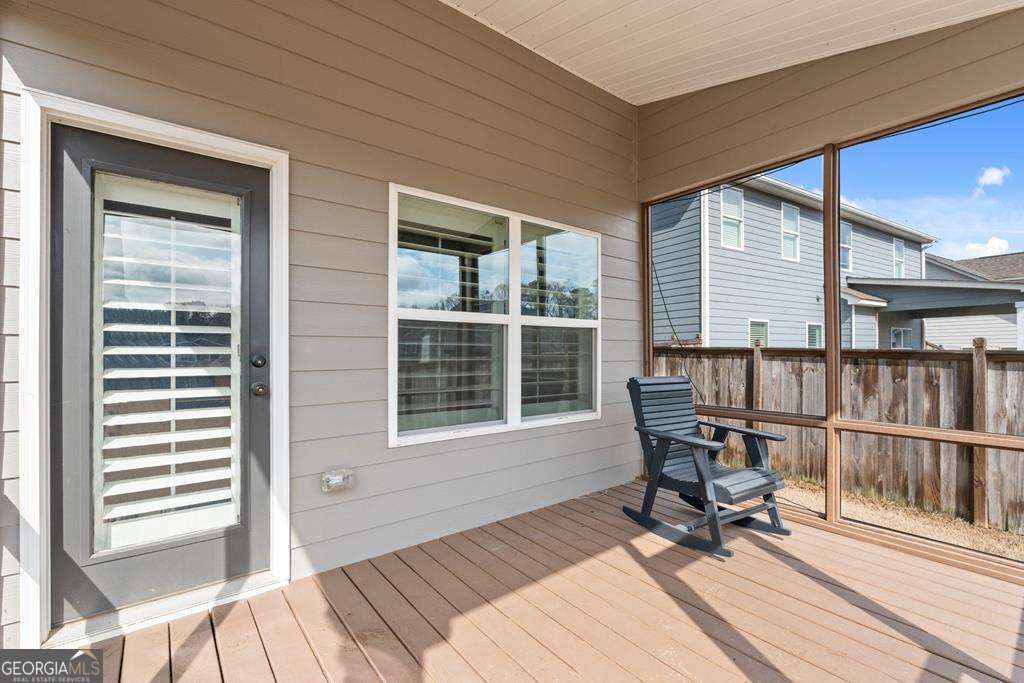 121 Cedar Pk Way Carrollton, GA 30117 - Photo 28 of 33 a balcony with table and chairs