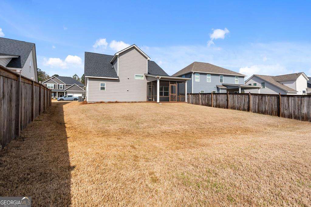 121 Cedar Pk Way Carrollton, GA 30117 - Photo 30 of 33 a view of a house with a yard
