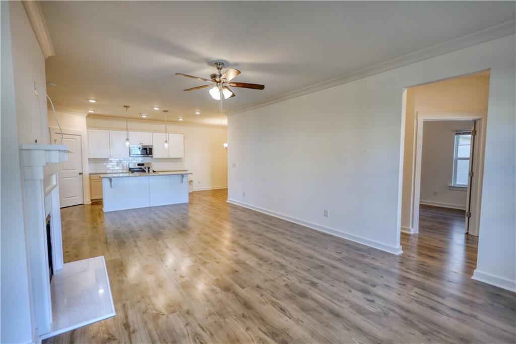 2929 Rambler Drive Loganville, GA 30052 - Photo 11 of 49 a view of a kitchen with wooden floor and a kitchen