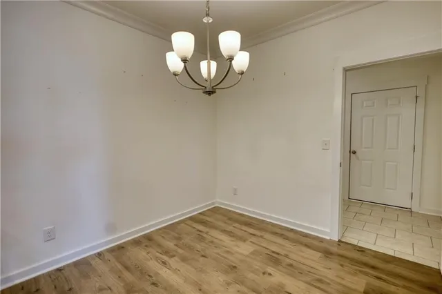 an empty room with wooden floor