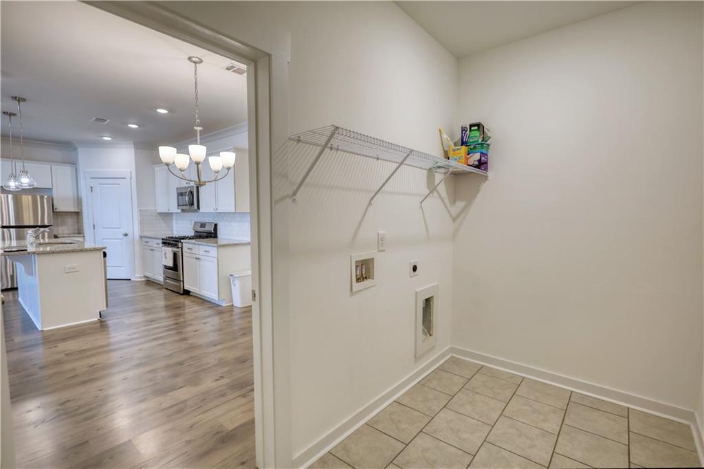 2929 Rambler Drive Loganville, GA 30052 - Photo 25 of 49 a view of a kitchen with microwave and cabinets