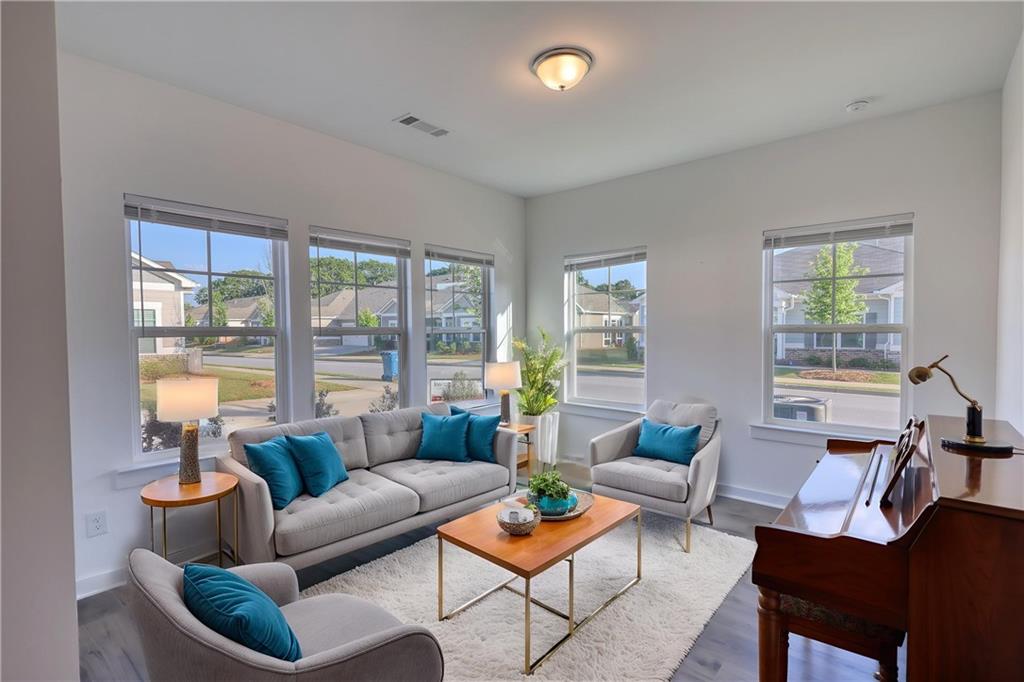 2929 Rambler Drive Loganville, GA 30052 - Photo 31 of 49 a living room with furniture and a large window