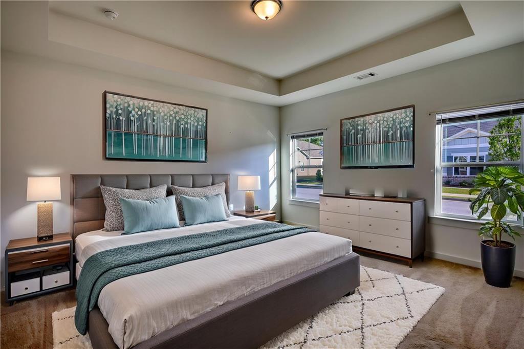 2929 Rambler Drive Loganville, GA 30052 - Photo 36 of 49 a bedroom with a bed and furniture