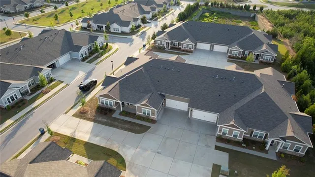 an aerial view of a house with a swimming pool