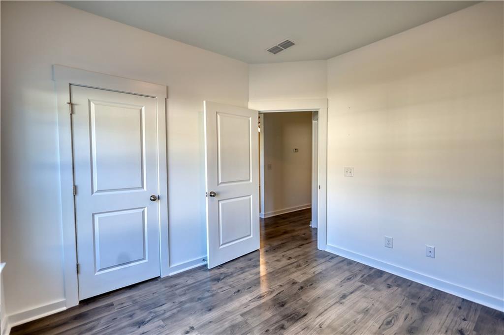 2929 Rambler Drive Loganville, GA 30052 - Photo 41 of 49 a view of an empty room and wooden floor