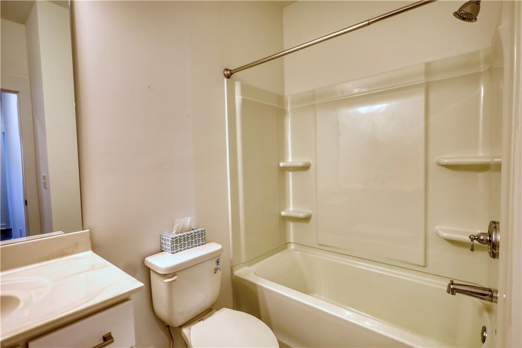 2929 Rambler Drive Loganville, GA 30052 - Photo 43 of 49 a bathroom with a sink and a bathtub