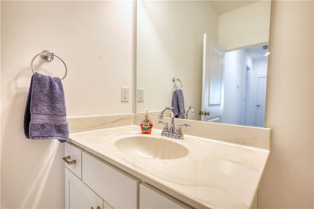 2929 Rambler Drive Loganville, GA 30052 - Photo 44 of 49 a bathroom with a sink and a mirror