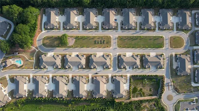 a front view of residential house with outdoor space and car parked