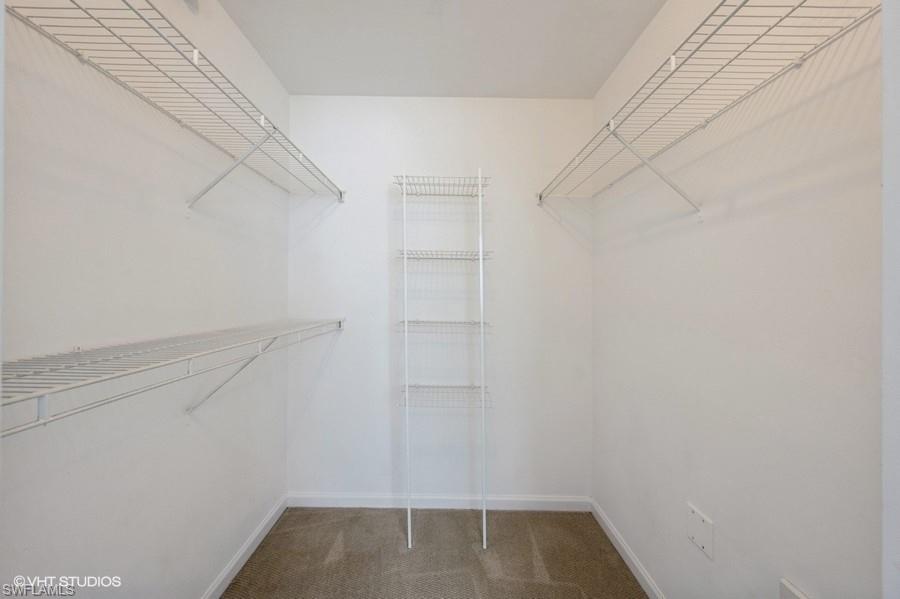 1170 Reserve Way, Unit 107 Naples, FL 34105 - Photo 20 of 41 Spacious closet featuring carpet