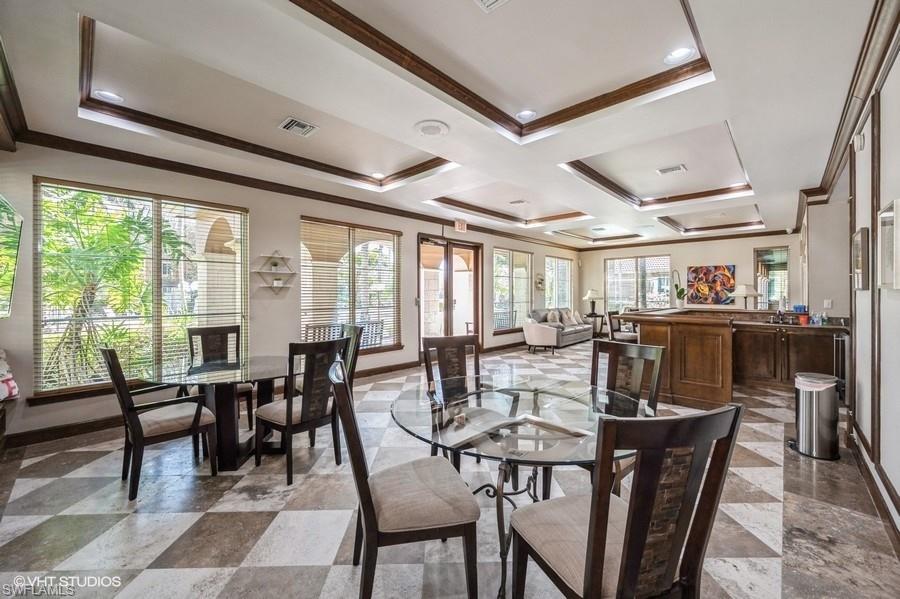 1170 Reserve Way, Unit 107 Naples, FL 34105 - Photo 35 of 41 Clubhouse featuring crown molding and coffered ceiling