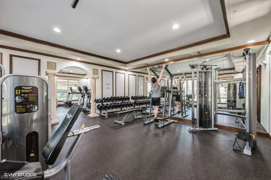 1170 Reserve Way, Unit 107 Naples, FL 34105 - Photo 37 of 41 Exercise room featuring crown molding and decorative columns