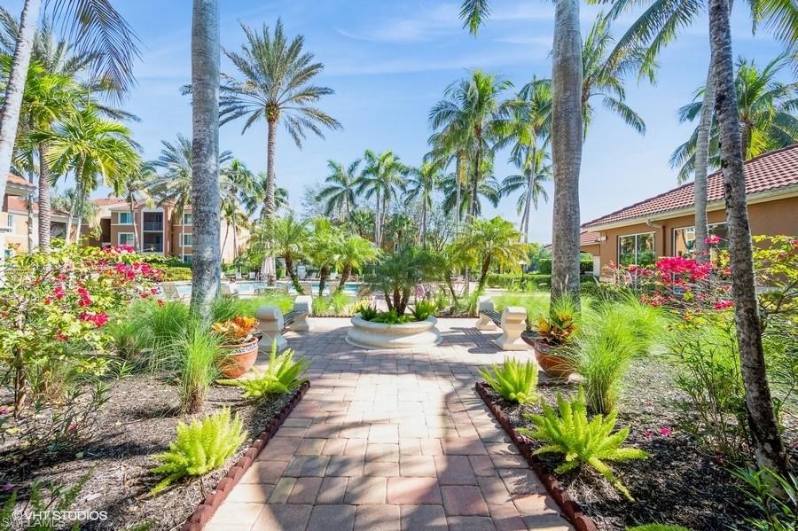 1170 Reserve Way, Unit 107 Naples, FL 34105 - Photo 41 of 41 View of community featuring a patio by the pool
