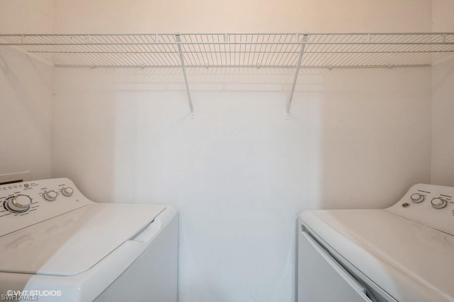 1170 Reserve Way, Unit 107 Naples, FL 34105 - Photo 10 of 41 Laundry room featuring separate washer and dryer