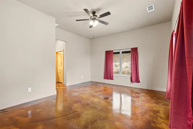 a view of an empty room and window