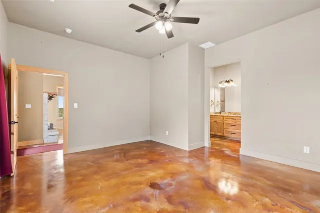 a bathroom with a granite countertop sink double vanity and a mirror