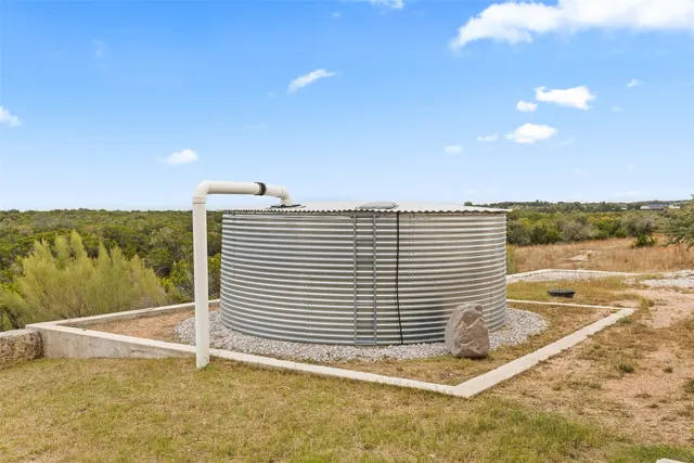 an aerial view of residential building with trees