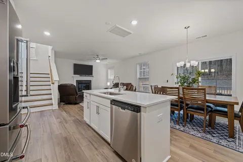 a view of entryway with wooden floor and stairs