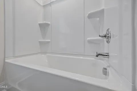 a bedroom with a bed and a table