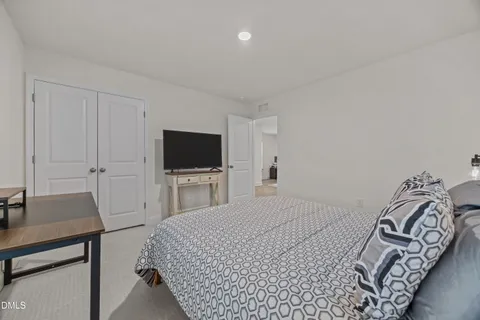 a view of a room with wooden floor and windows