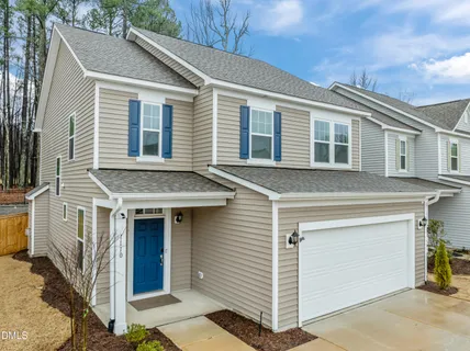 a front view of a house with a garage
