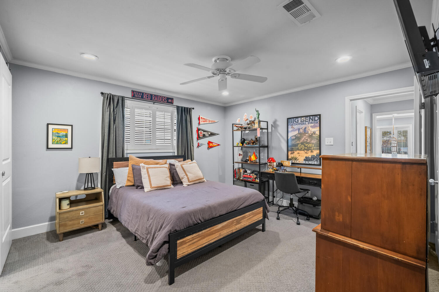 3114 76th Street Lubbock, TX 79423 - Photo 56 of 77 a bedroom with a bed dresser and a window