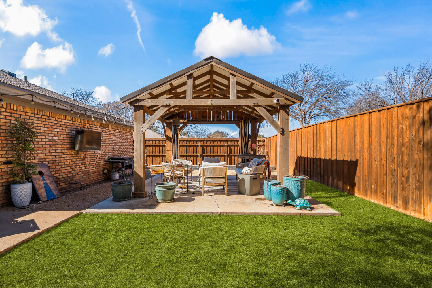 3114 76th Street Lubbock, TX 79423 - Photo 63 of 77 a view of a chairs and table in the patio