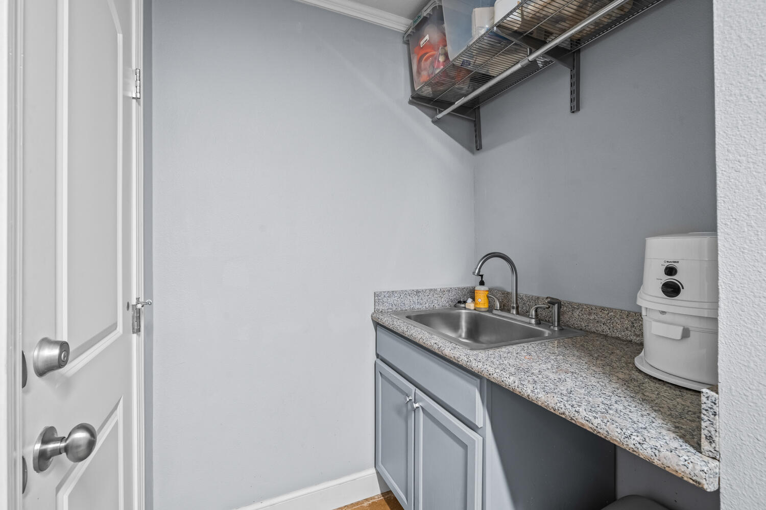 3114 76th Street Lubbock, TX 79423 - Photo 67 of 77 a bathroom with a granite countertop sink a toilet and vanity